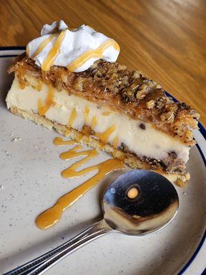 The Baklava Cheesecake with walnuts and whipped cream and caramel sauce.