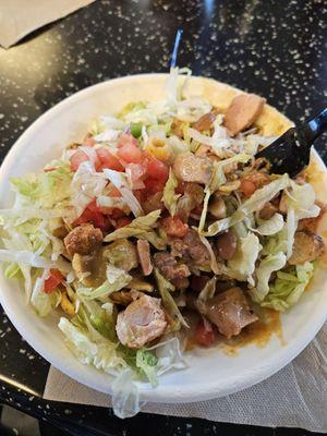 Frito pie with Green Chili and Chicken added for an extra charge