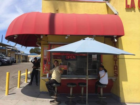 You can sit on the stools outside and enjoy your tasty tacos and burritos.