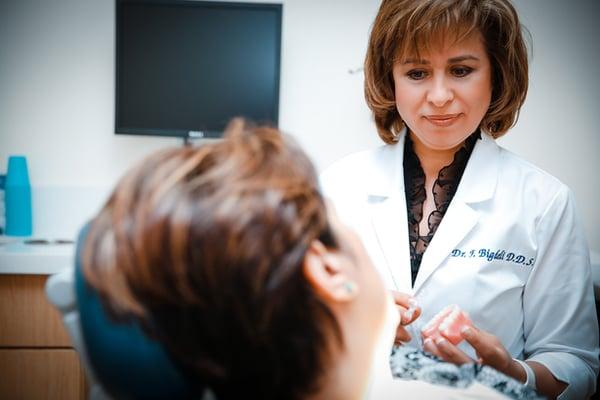 Explaining the benefits of braces to an adult patient.