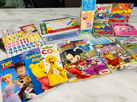 Lots of Disney, Nickelodeon, and PBS themed activity books, board books, writing paper, and puzzles. The puzzles are hit or miss in quality.