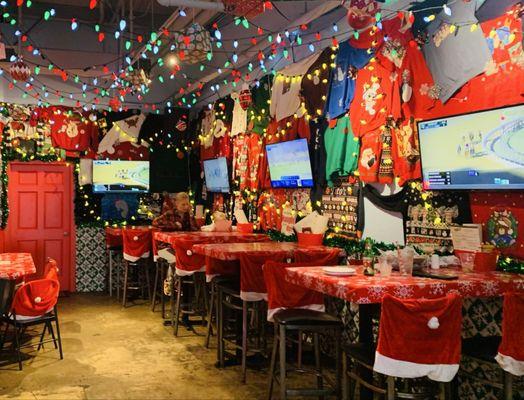 Dining room w tons of TVs and every inch decorated