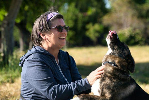 Buddy's Way K9®'s Sybl A Saisselin enjoying a moment with Service Dog graduate, Yue. BuddysWayK9.com