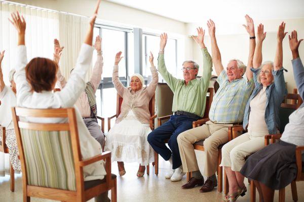 "Engaging Group Activity: Seniors Enjoying a Fun Exercise Session Together"