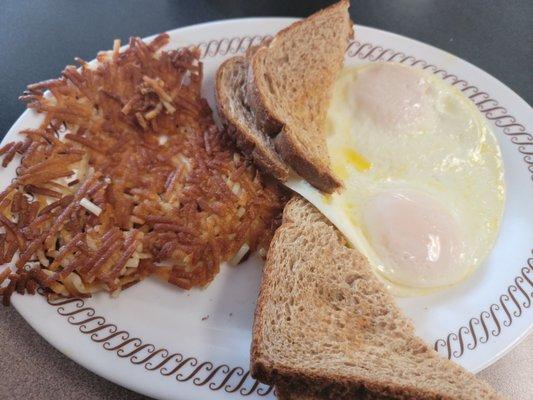 Extra crispy hashbrowns and over easy. Perfect.