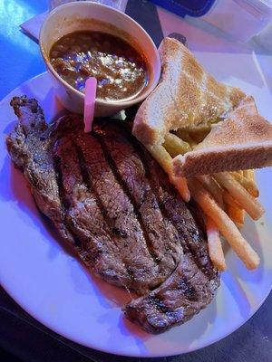 Ribeye with fries and baked beans