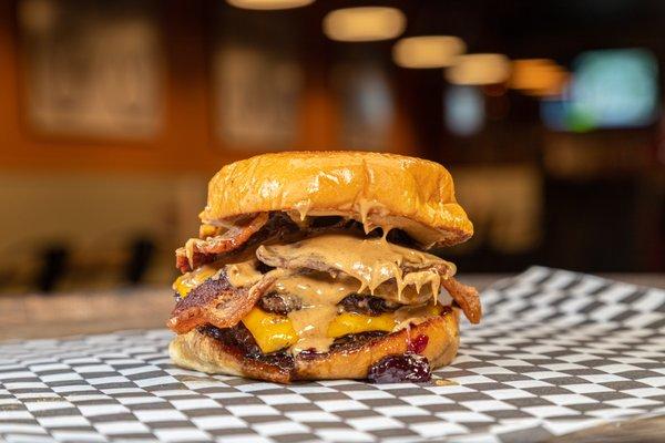 The Fat Elvis - Two American wagyu patties, two slices of cheddar cheese, bacon, peanut butter, and grape jelly.