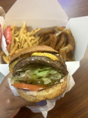 Cheese burger with fries and onions rings