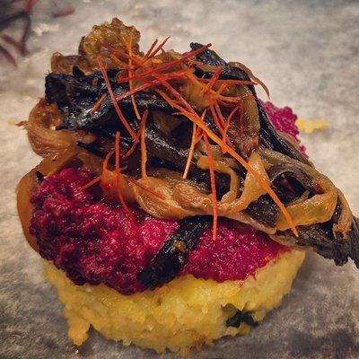 Vegan appetizer using beets, polenta, mushroom and chili.