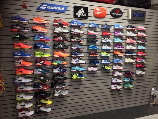 Tennis shoes selection, including Nike, adidas, babolat, new balance, and asics