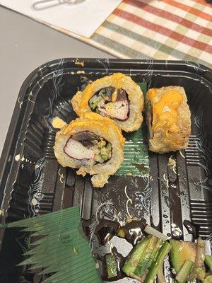 Spicy California roll with horrific looking avocado.