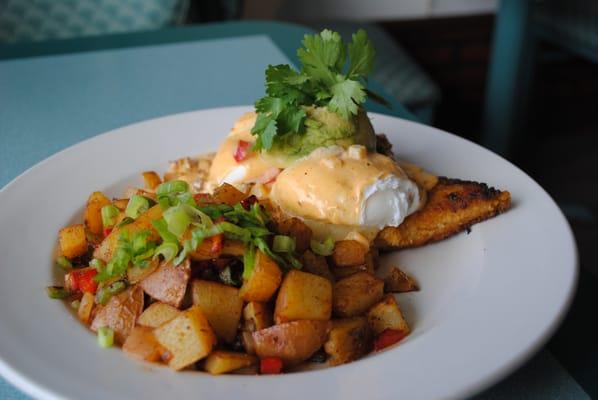 Poached eggs over polent with a chorizo pepper sauce. Served for breakfast on saturdays!