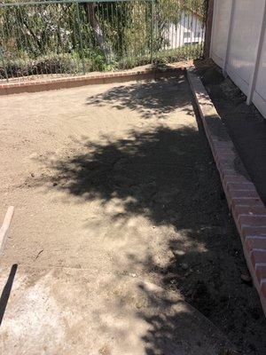 Starting to build out the red stone from the side of the home to the back yard