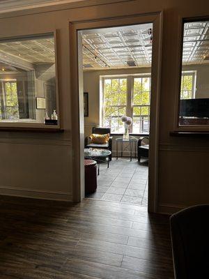 Cozy sitting room where people can enjoy a cigar and bourbon. Negative Air filters keep the smoke out.