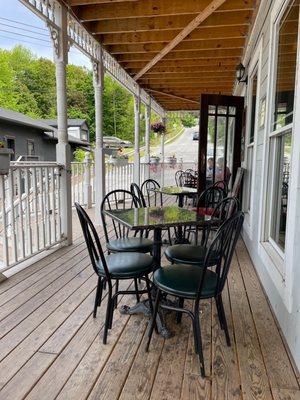 Outside porch seating allows dogs.