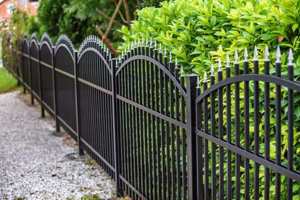 Wrought iron fence with spear top pickets