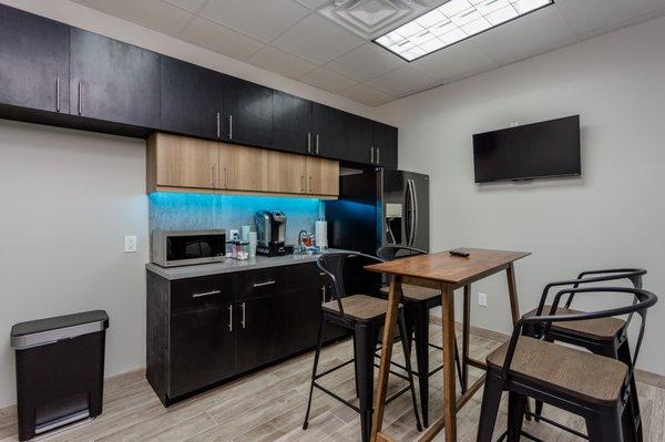 Kitchen with a fully stocked coffee bar!