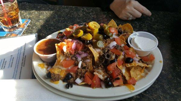 The happy hour nachos, that are a smaller portion than the regular size... Huge!