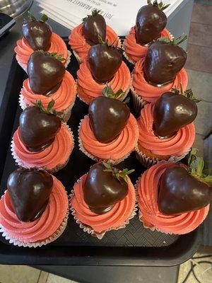 Chocolate dipped strawberries on chocolate cupcakes