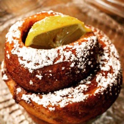 Naked Roll. Fresh baked Cinna-roll but with no frosting, just powdered sugar and a lemon wedge to add some acidity. Simple yet exquisite.