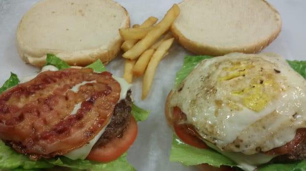 x tudo---8oz burger with egg ham tomatoes and romano letuce