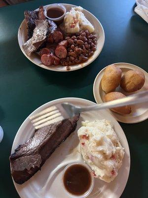 Three meat plate with beans and potato salad One meat plate with potato salad (fries not pictured) And fried rolls