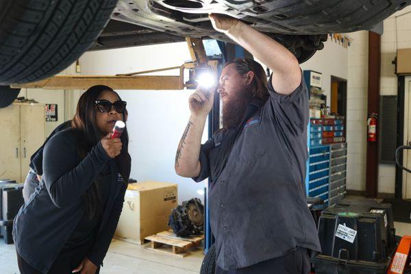 Showing a real customer what's going on with her vehicle from underneath!