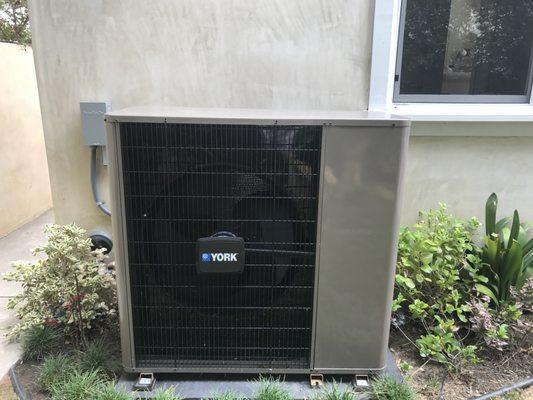 My Air Conditioning unit from Ocean Air.  Brand: York, Narrow Unit (for a smaller profile) due to limited backyard space.