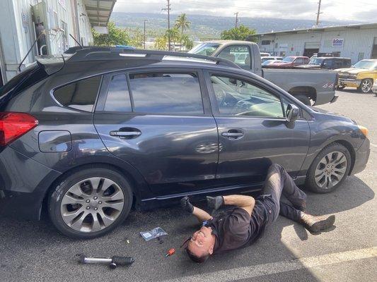 Owner Donny doing some Good Samaritan work on the side of my car, and throwing up the SHAKA BRAH!!