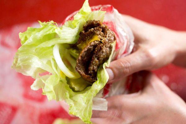 Burger in Lettuce Wrap with Onion and Pickles