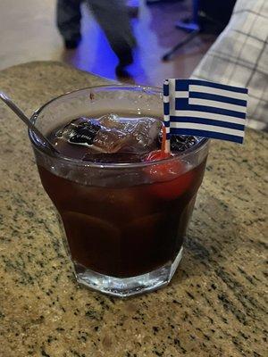 Nick The Greek custom made drink with Ouzo , Greek cherrys and vodka .