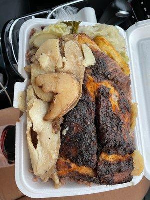 Jerk salmon meal comes with potatoes, rice and peas, veg, plantain