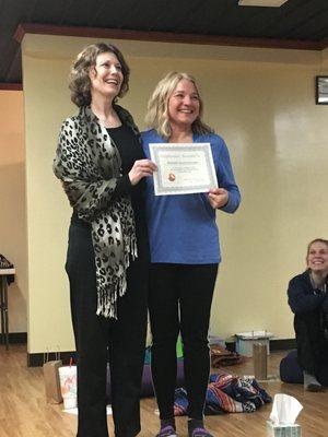 Mary presenting Maggie with her RYT certificate in April, 2018.