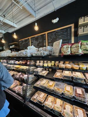 Inside - take out meal counter with sandwiches, pasta, and more