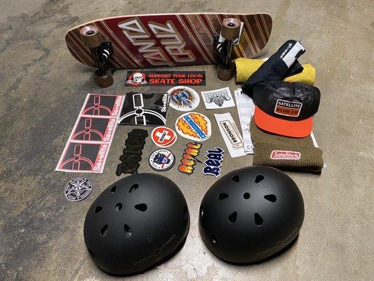 Skateboard, helmets, hats, shirts and stickers