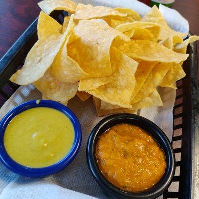 Chips and salsa.  The green salsa is yummy.