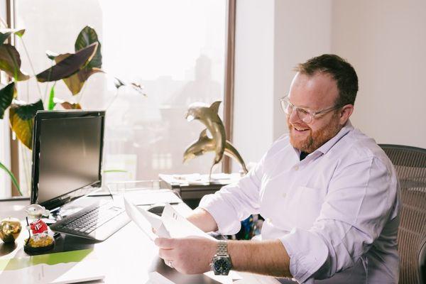 Chris, our CIO and a pivotal member of the executive investment team, reviewing some hand written notes.