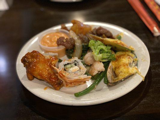 Sushi, broccoli shrimp , and chicken wings