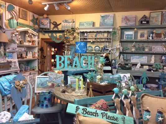 Decors, plates, table tray, mugs, beach ornaments, throw pillows, towels, furnitures.