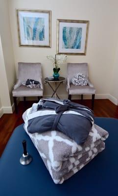 Treatment room (including seating area, patient robe and towels on treatment table)