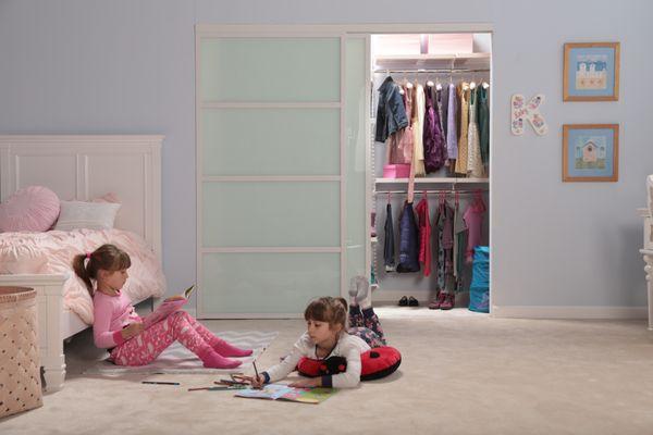 white framed girls closet doors, milky glass doubles as a dry erase board too!