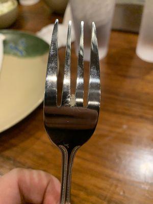 Looks to be old rice stuck in the fork. I requested plastic