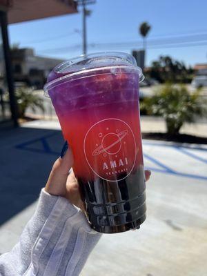 Galaxy Lemonade with 2x boba strawberry lemonade topped with butterfly pea tea + strawberry bits