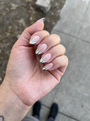 Nude base and silver chrome tips.