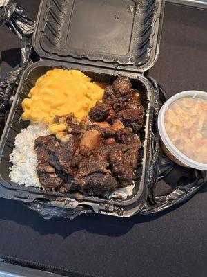 Oxtails white rice Mac & Cheese, cabbage