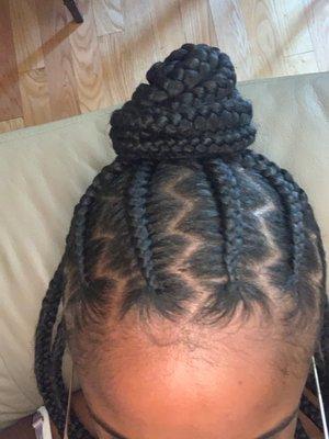 Half up half down jumbo tribal braids with zig zag parts