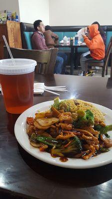 Chicken with mixed vegetables with pork fried chicken, iced tea on the left