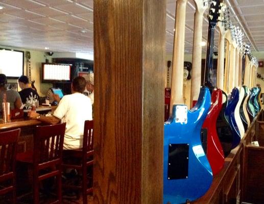 Some of the many autographed guitars