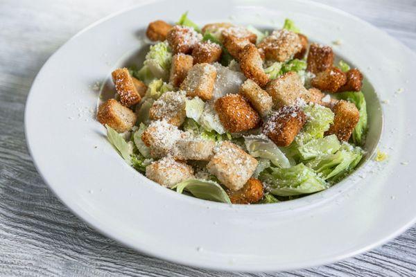 A classic Caesar with crisp lettuce, savory croutons, and shredded parmesan, all tossed in a creamy dressing