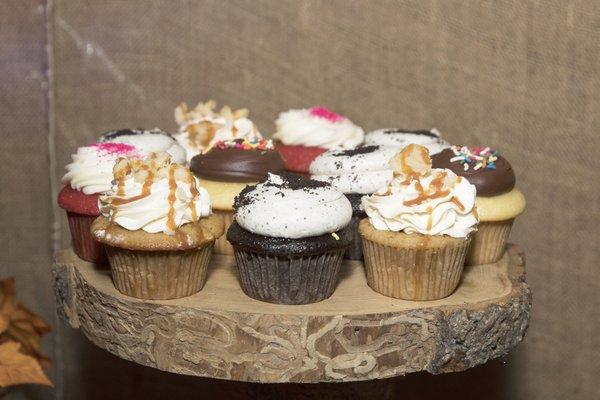 Cupcakes on a rustic display.